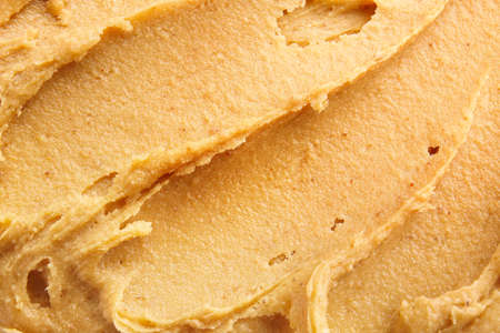 Tasty peanut butter as backgroundの写真素材