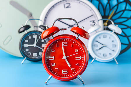 Many different clocks on tableの写真素材