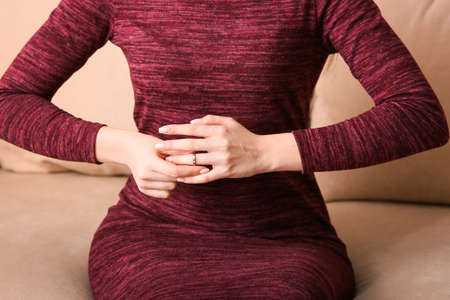 Woman taking off her wedding ring, closeup. Concept of divorceの写真素材
