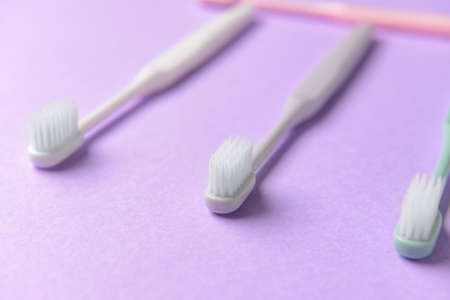 Tooth brushes on color backgroundの写真素材