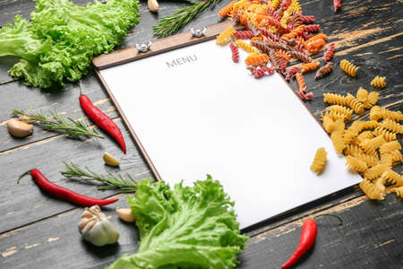 Blank menu and products on wooden background