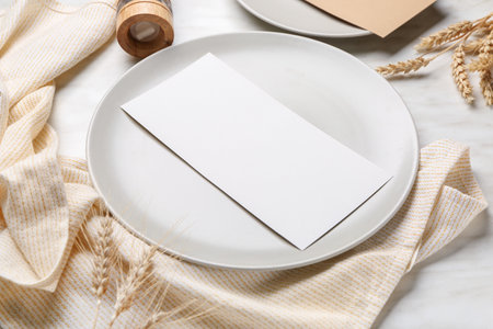 Beautiful table setting on light backgroundの写真素材