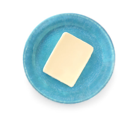 Plate with fresh butter on white backgroundの写真素材