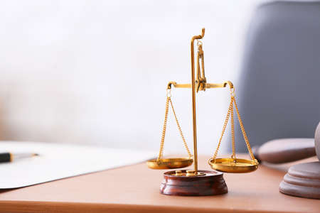 Scales of justice on lawyer's workplaceの写真素材