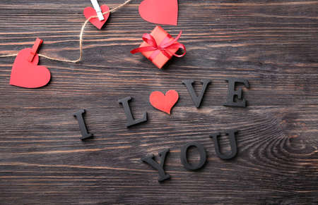Gift for Valentine's Day, decor and text I LOVE YOU on wooden backgroundの写真素材