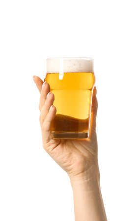 Hand with glass of beer on white backgroundの写真素材