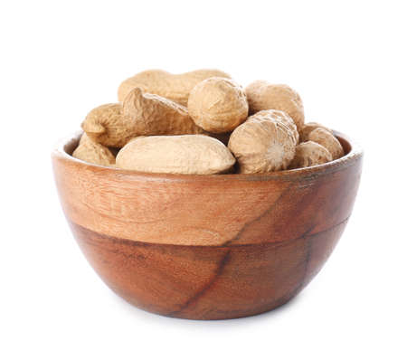 Bowl with peanuts on white background