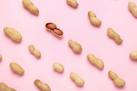 Tasty peanuts on color backgroundの写真素材