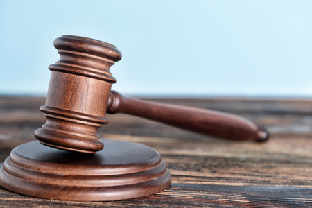 Judge's gavel on wooden table