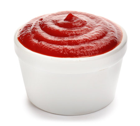 Bowl with tasty tomato sauce on white backgroundの写真素材