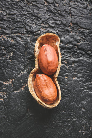 Raw peanut on dark background