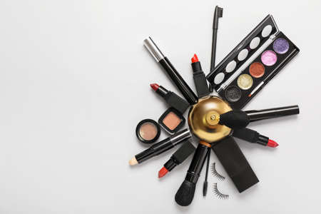 Bottle of perfume and cosmetics on light backgroundの写真素材