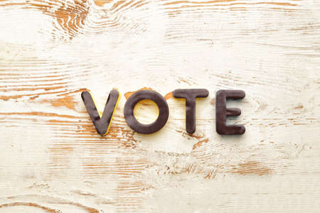 Text VOTE on wooden backgroundの写真素材