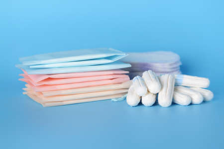 Menstrual pads with tampons on color backgroundの写真素材