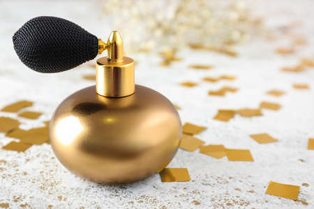 Bottle of perfume on light tableの写真素材