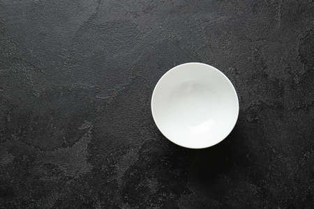 Empty plate on dark backgroundの写真素材