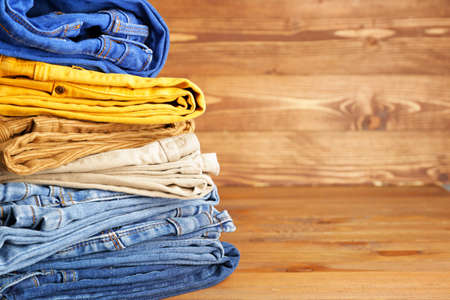 Stack of warm clothes on tableの写真素材