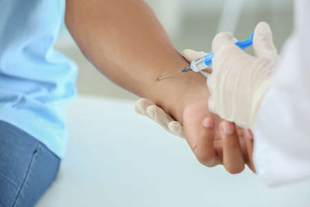 Female doctor conducting Mantoux test in clinicの写真素材