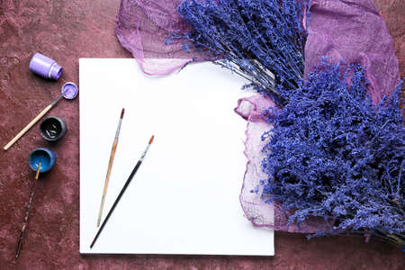 Set of artist's supplies on color background