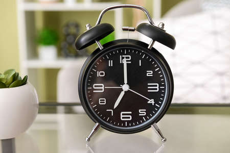 Alarm clock on table in room