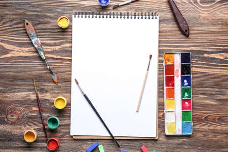 Set of artist's supplies on wooden backgroundの写真素材