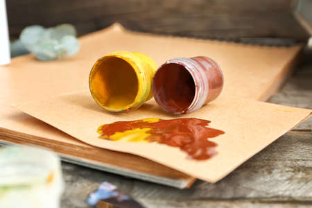 Artist's supplies on wooden background, closeup