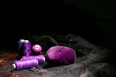Set of tailor's supplies on dark backgroundの写真素材