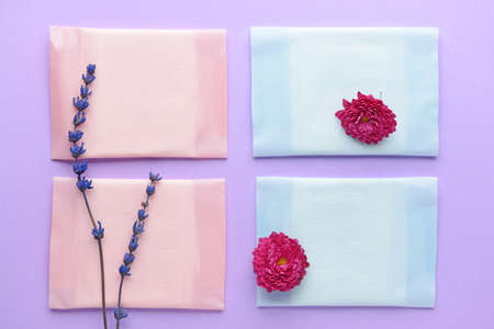 Menstrual pads with flowers on color backgroundの写真素材