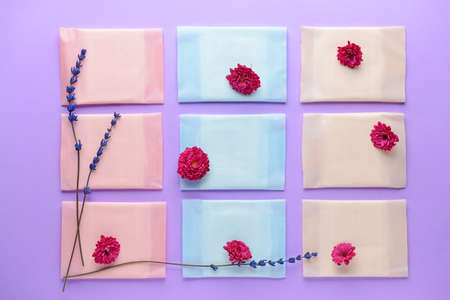 Menstrual pads with flowers on color backgroundの写真素材