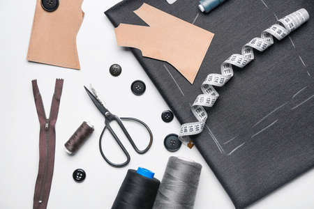 Set of tailor's supplies with sewing pattern on white backgroundの写真素材