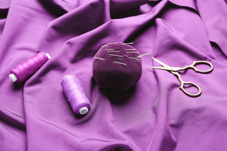 Set of tailor's supplies on fabricの写真素材