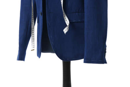 Mannequin with half-finished jacket and measuring tape on white backgroundの写真素材