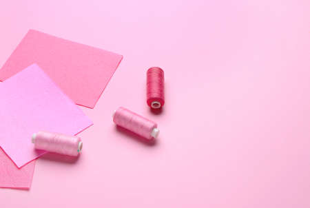 Sewing threads on color backgroundの写真素材