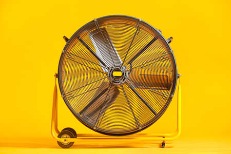 Electric fan on color backgroundの写真素材