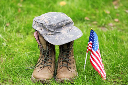 Military boots, hat and USA flag outdoors. Memorial day celebrationの写真素材