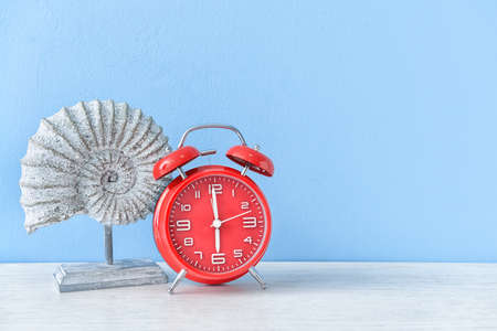 Alarm clock with decor on tableの写真素材