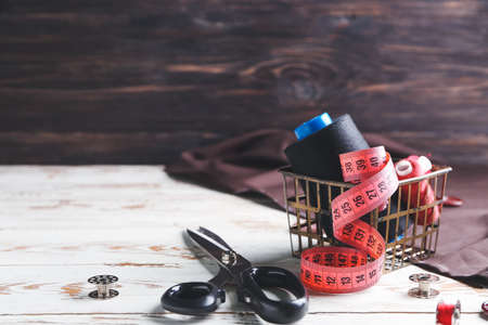 Set of tailor's supplies on table