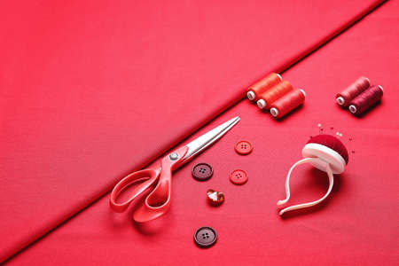 Set of tailor's supplies on fabricの写真素材