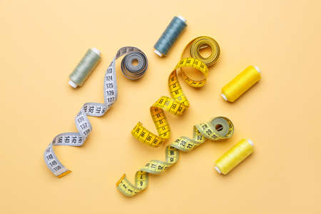 Set of tailor's supplies on color backgroundの写真素材