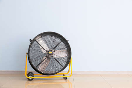 Electric fan near color wallの写真素材