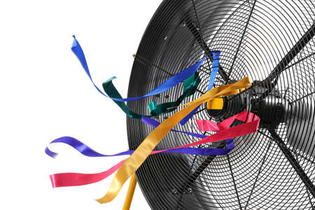 Electric fan with fluttering ribbons on white background, closeupの写真素材
