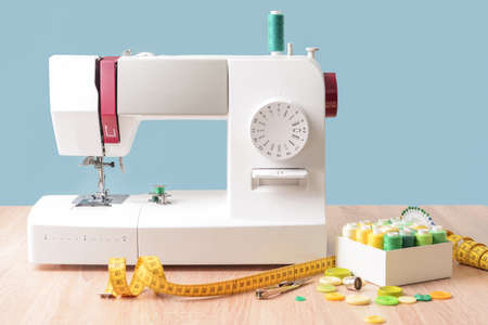 Sewing machine with supplies on table