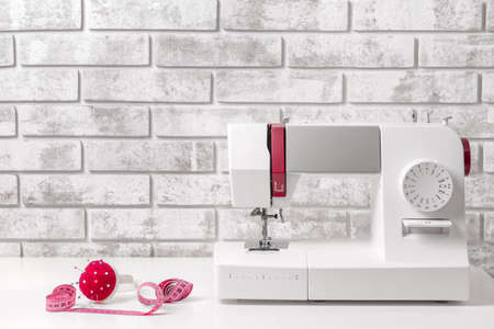 Sewing machine with supplies on table