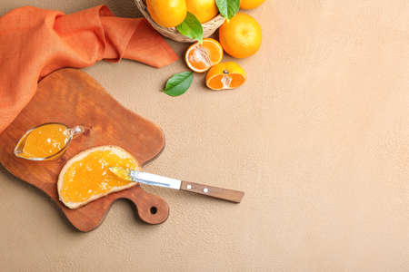 Composition with sweet tangerine jam on tableの写真素材