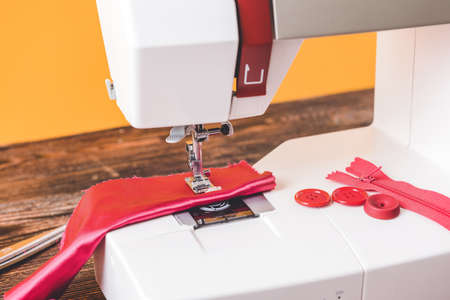 Sewing machine with supplies on table, closeupの写真素材