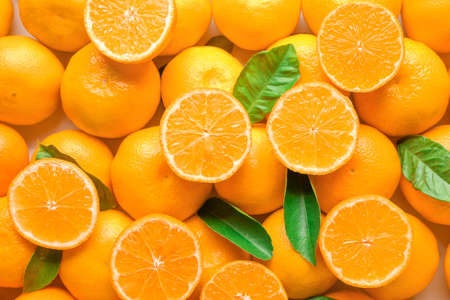 Ripe tasty tangerines as backgroundの写真素材