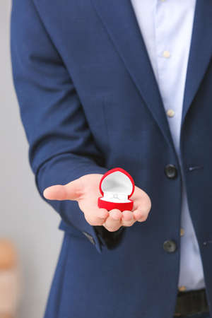 Man holding box with engagement ring, closeupの写真素材