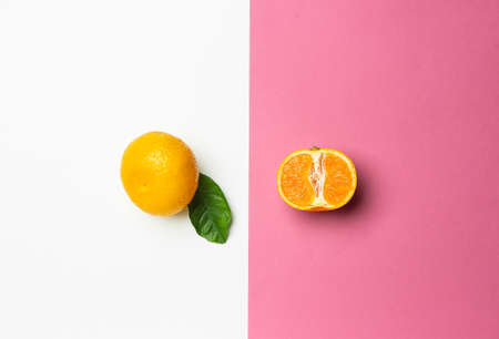 Ripe tasty tangerines on color backgroundの写真素材