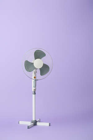 Electric fan on color backgroundの写真素材