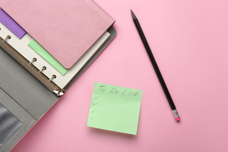 Notebook and blank to-do list on color backgroundの写真素材